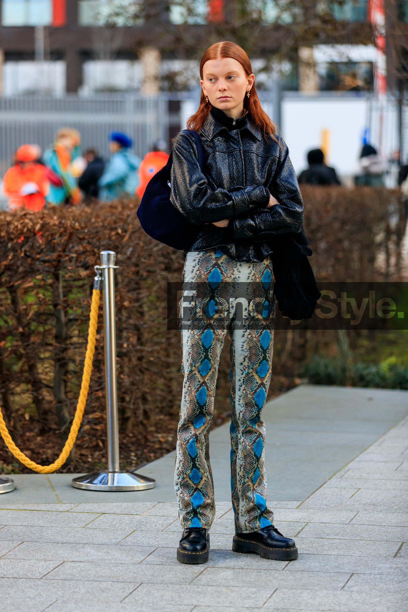 model, black polish jacket, black vinyl jacket, knoted jacket, cross shape earrings, hoop earrings, dangling earrings, nude make up, animal skin pants, blue leather pants, beige leather pants, light beige leather pants, black leather boots, doc marteens shoes, flat boots, laced boots, flare pants, fashion week, frenchystyle, FW, jonathan paciullo, street style, LFW, LONDON, AUTUMN WINTER 2020-2021, FALL WINTER 2020-2021, FW 20-21, vertical, full length