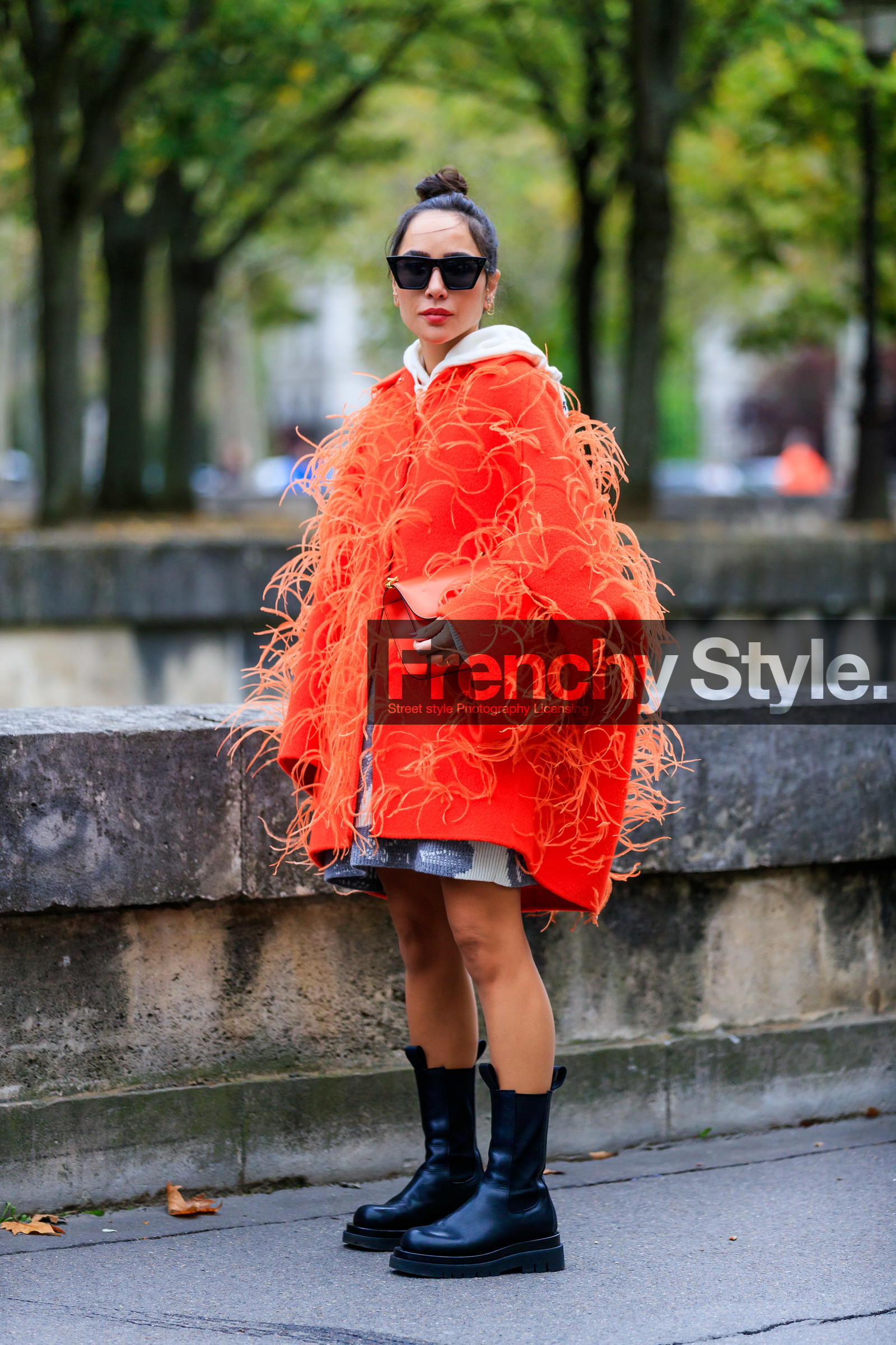 dana hourani, orange coat, white hoodie, letter embroidered pullover, valentino look, black leather boots, flat boots, chelsea boots, black sunglasses, futurist shape sunglasses, PARIS, PFW, SPRING SUMMER 2020, SS 20, fashion week, frenchystyle, FW, jonathan paciullo, street style, vertical, full length