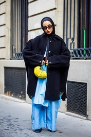 bag, black coat, black sunglasses, blue pants, coat, flare pants, hijab, large pants, Leena Al Ghouti, loewe bag, oversize coat, pants, sunglasses, yellow bag, street style, jonathan paciullo, FW, frenchystyle, fashion week, PFW, PARIS, SPRING SUMMER 2022, SS 22, vertical, full length