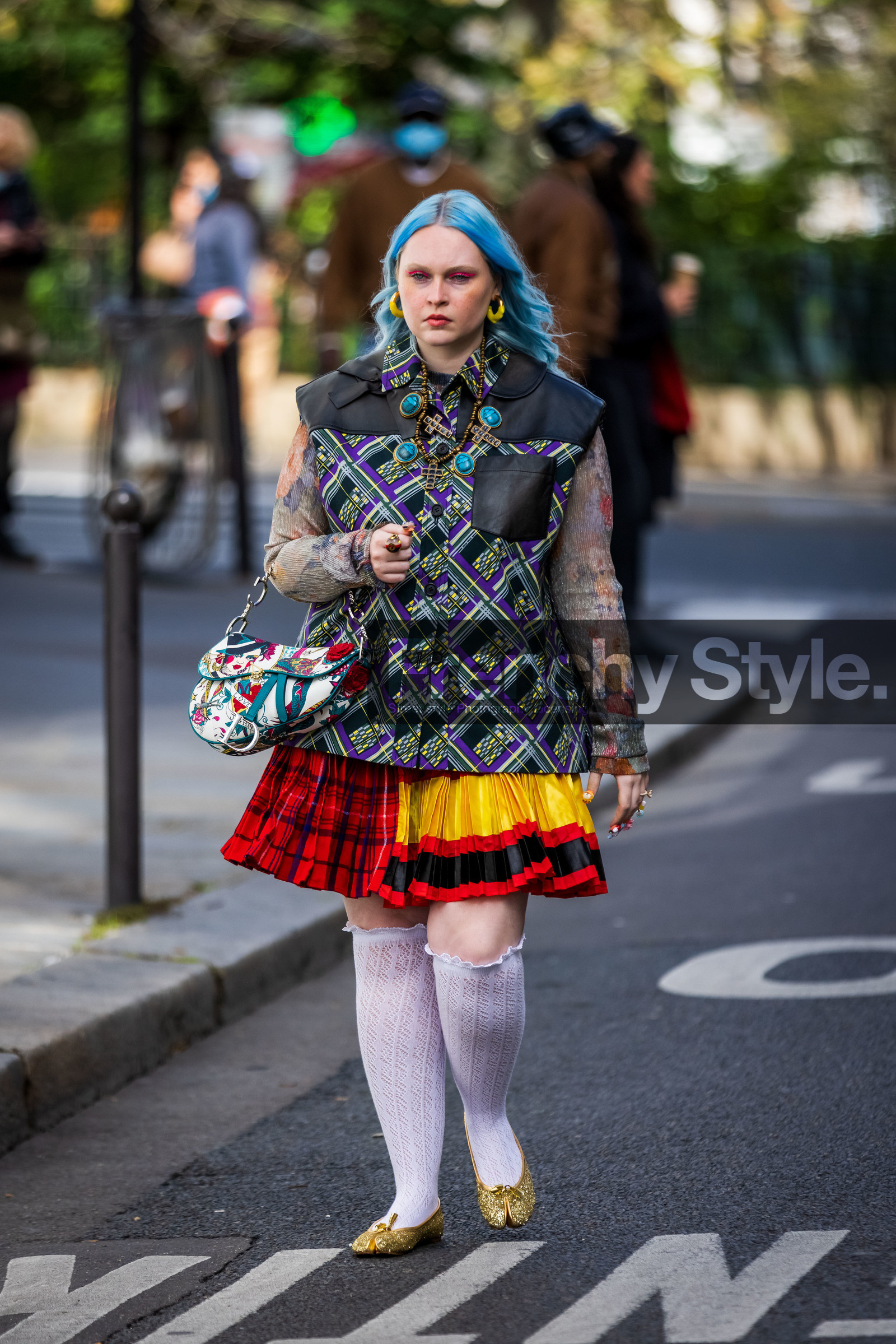 bag, ballerines, blue hair, color, cross, dior bag, earrings, flats, floral print, flower, fluo pink eyeliner, gold ballerines, green jacket, jacket, Kristen Bateman, multicolor, necklace, pleated skirt, printed bag, printed jacket, printed shirt, printed skirt, purple jacket, red skirt, shirt, short skirt, skirt, sleveless jacket, socks, tartan, white socks, yellow skirt, street style, jonathan paciullo, FW, frenchystyle, fashion week, PFW, PARIS, SPRING SUMMER 2022, SS 22, vertical, full length