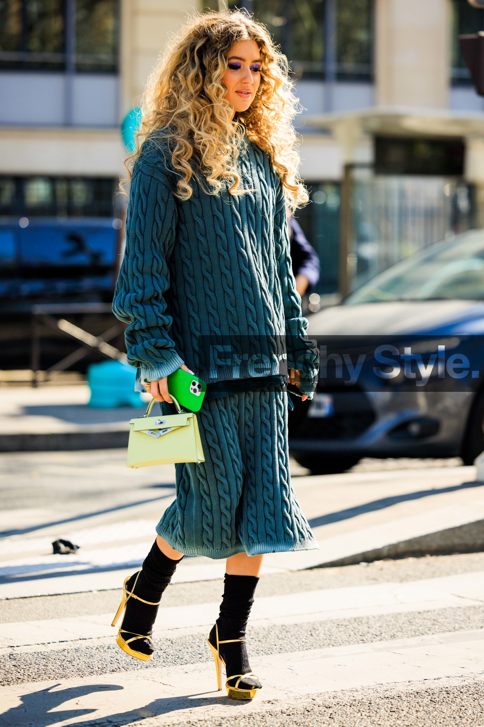 curly hair, knitted look, miu miu, blue jumper, blue skirt, knitted jumper, knitted skirt, knitwear, black socks, golden heels, green handbag, hermes bag, birkin bag, emili sindlev, FW 22-23, FALL WINTER 2022_2023, AUTUMN WINTER 2022-2023, fashion week, frenchystyle, FW, jonathan paciullo, street style, PFW, PARIS, full length, vertical