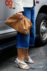 erika boldrin, bottega veneta bag, beige clutch, light beige clutch, white leather sandals, kitten heels sandals, blue jeans, cropped jeans, denim, denim bermuda shorts, legs detail, shoes detail, bag detail, close up detail, fashion week, frenchystyle, FW, jonathan paciullo, street style, NYFW, NEW YORK, AUTUMN WINTER 2020-2021, FALL WINTER 2020-2021, FW 20-21, vertical, atmosphere details, detail