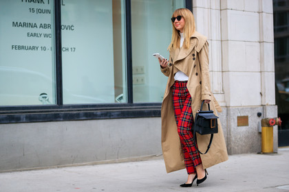 beige coat, black bag, black shoes, checked, checked pants, graphic pants, high heels, leather bag, leather shoes, plaid, printed pants, red pants, sunglasses, tartan, trench coat, trousers, white sweater, street style, jonathan paciullo, FW, frenchystyle, fashion week, NYFW, NEW YORK, AUTUMN WINTER 2018-2019, AW 18-19, FALL WINTER 2018-2019, FW 18-19, atmosphere details, horizontal, full length, lisa aiken