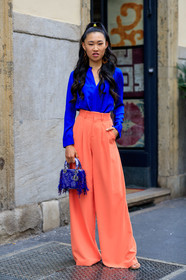 jaime xie, blue shirt, silk shirt, long sleeves shirt, orange pants, loose pants, flare pants, high waist pants, dangling earrings, golden earrings, dior bag, hand bag, blue bag, fringe bag, fashion week, frenchystyle, FW, jonathan paciullo, street style, MFW, MILAN, SPRING SUMMER 2020, SS 20