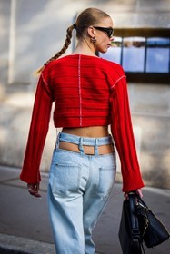 crop knitwear, bag, black bag, black sunglasses, cut out pants, denim, earrings, Hilda Sandstrom, jean, knitwear, light blue denim, light blue jean, red knitwear, sunglasses, back, back detail, street style, jonathan paciullo, FW, frenchystyle, fashion week, PFW, PARIS, SPRING SUMMER 2022, SS 22, vertical, atmosphere details