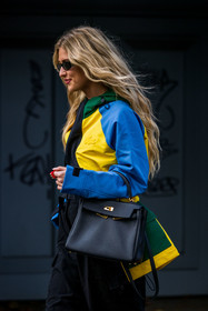 bag, black bag, black pants, black sunglasses, blue jacket, cap, color, Emili Sindlev, hermes bag, jacket, la manso ring, lacoste jacket, lacoste look, leather bag, pants, ring, sunglasses, yellow jacket, lacoste, fashion week, frenchystyle, FW, jonathan paciullo, street style, PFW, PARIS, SPRING SUMMER 2022, SS 22, vertical, atmosphere details