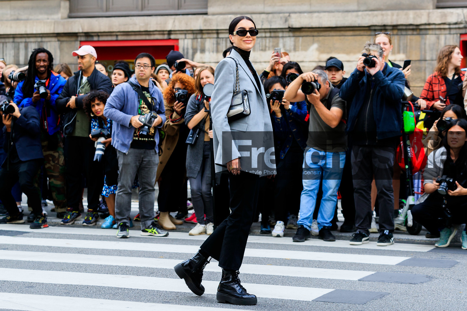 brittany xavier, light green jacket, black blouse, black denim pants, lace blouse, high collar blouse, black sunglasses, butterfly sunglasses, versace sunglasses, chanel bag, sheer bag, plastic bag, shoulder bag, chain strap bag, flat boots, black leather boots, low boots, big sole boots, PARIS, PFW, SPRING SUMMER 2020, SS 20, fashion week, frenchystyle, FW, jonathan paciullo, street style, horizontal, atmosphere details, full length