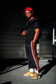black pants, black t shirt, camera, fashion week, frenchystyle, full length, FW, golden sneakers, jonathan paciullo, kangol, nabile quenum, NEW YORK, nike, NYFW, red hat, SPRING SUMMER 2018, SS 18, street style, sweatpants, trousers, vertical, white socks