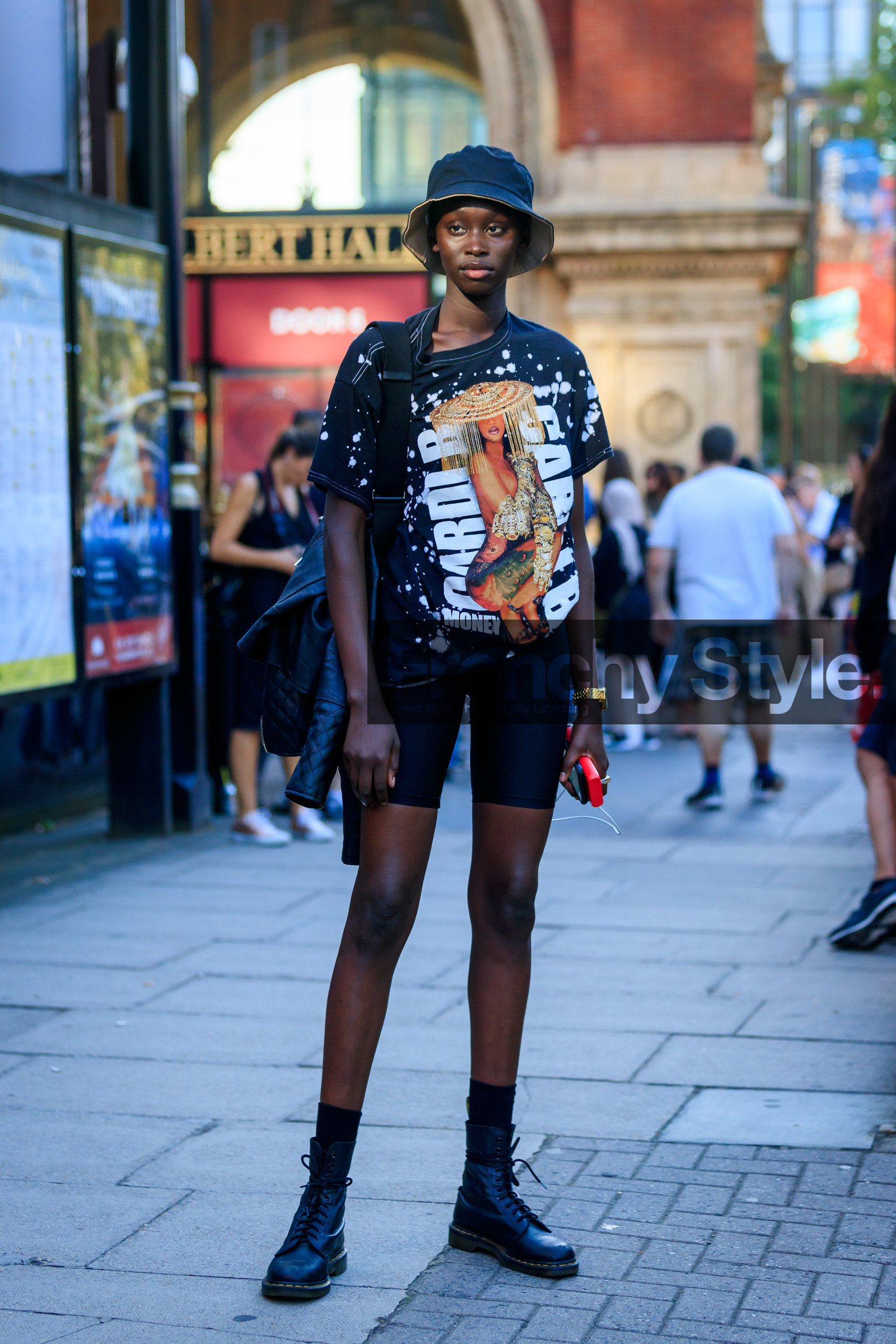 model, black hat, black t-shirt, printed t-shirt, cardi b t-shirt, black shorts, tight shorts, doc marteens shoes, black socks, black leather shoes, laced shoes, fashion week, frenchystyle, FW, jonathan paciullo, street style, vertical, full length