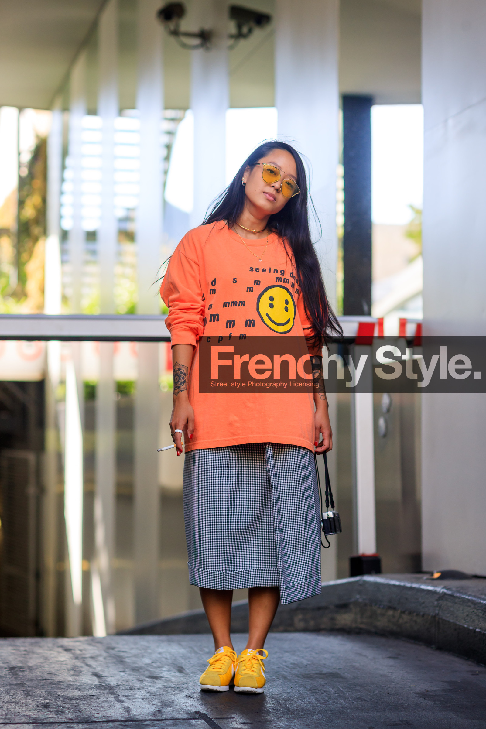 camera, christina paik, fashion week, frenchystyle, full length, FW, graphic skirt, grey skirt, jonathan paciullo, leather shoes, MENSWEAR, nike, orange sweater, PARIS, PFW, plaid, printed skirt, printed sweater, smiley, SPRING SUMMER 2018, SS 18, street style, sunglasses, tattoos, vertical, yellow sneakers