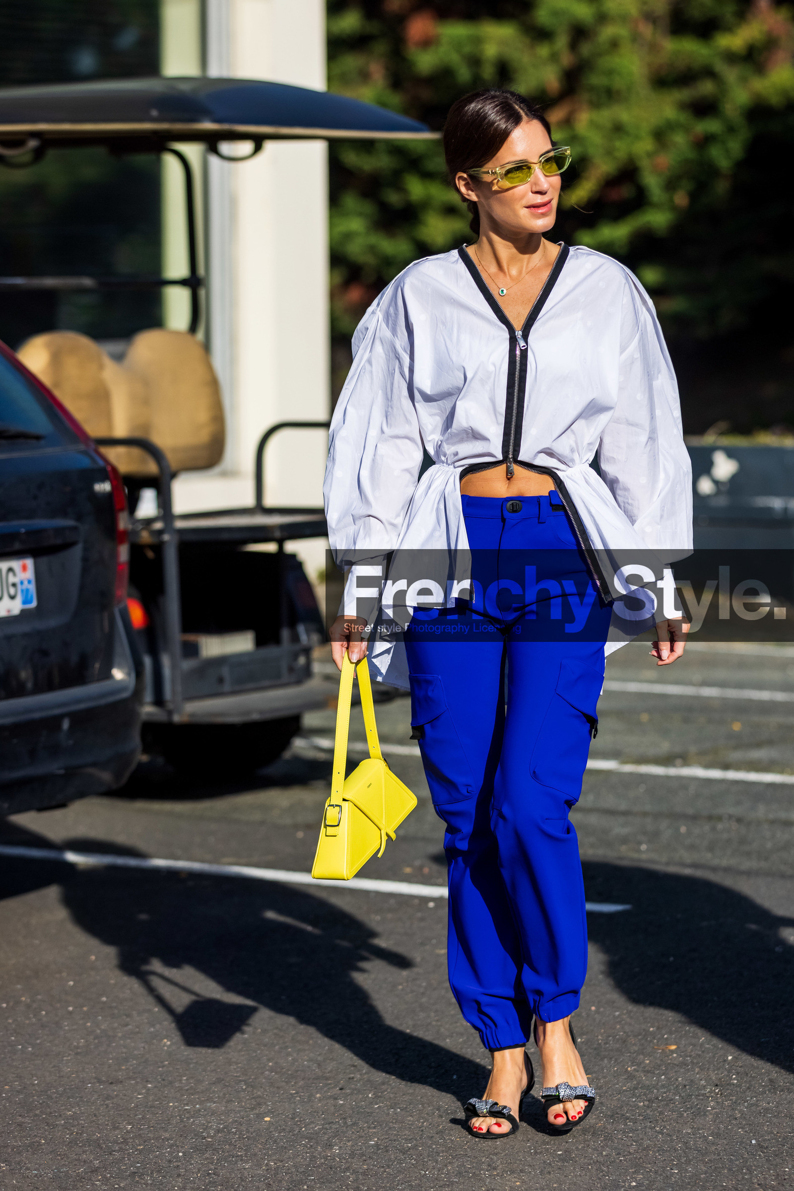 bag, black sandals, cargo pants, color, electric blue pants, Gala Gonzalez, pants, sandals, shirt, statement heels, sunglasses, transparent sunglasses, white shirt, yellow bag, yellow sunglasses, zipped shirt, street style, jonathan paciullo, FW, frenchystyle, fashion week, PFW, PARIS, SPRING SUMMER 2022, SS 22, vertical, full length