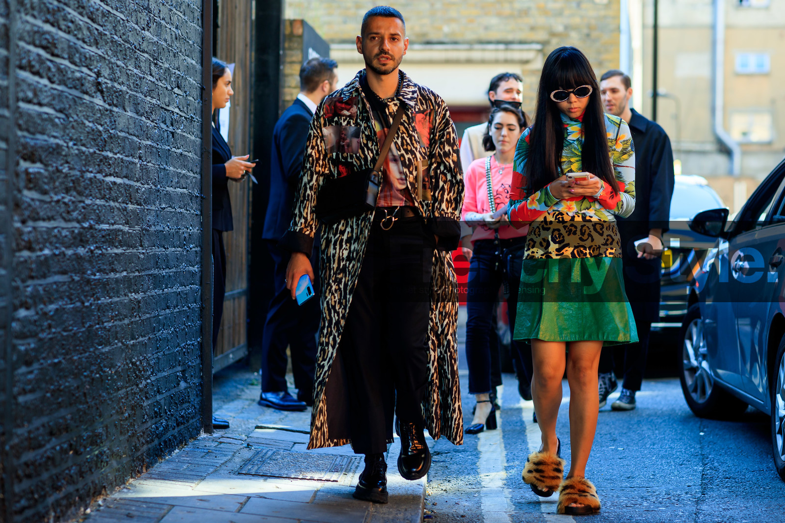 susie lau, crossbody bag, animal print coat, chain necklace, screen print caot, screen print shirt, sunglasses, strassed sunglasses, animal print top, turtleneck top, leather skirt, green skirt, tropical print top, fur sandals, fashion week, frenchystyle, FW, jonathan paciullo, street style, atmosphere details, horizontal, full length