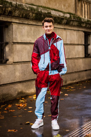 blue jacket, blue pants, burgundy jacket, burgundy pants, color, jogging pants, menswear, Noah Schnapp, print, red jacket, red pants, sneakers, tracksuits, white sneakers, zipped jacket, lacoste, fashion week, frenchystyle, FW, jonathan paciullo, street style, PFW, PARIS, SPRING SUMMER 2022, SS 22, vertical, full length