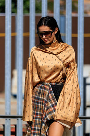 doina ciobanu, aviator sunglasses, brown scale sunglasses, high collar blouse, satin blouse, monogrammed blouse, oversize sleeves, crossbody bag, light brown bag, brown leather bag, mini bag, square shape bag, asymmetrical skirt, checked skirt, plaid skirt, beige skirt, black shorts, high waist shorts, embroidered shorts, velvet shorts, dark brown sandals, brown leather sandals, carrera sunglasses, multi rings, golden rings, fashion week, frenchystyle, FW, jonathan paciullo, street style, vertical, detail, atmosphere details