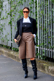 black jacket, black top, white shirt, strapless top, brown leather bermuda shorts, brown bermuda shorts, leather bermuda shorts, diamond earrings, prada clutch, prada top, military printed bag, military printed clutch, smoked sunglasses, big sunglasses, high boots, black leather boots, fashion week, frenchystyle, FW, jonathan paciullo, street style, MFW, MILAN, AUTUMN WINTER 2020-2021, FALL WINTER 2020-2021, FW 20-21, vertical, full length