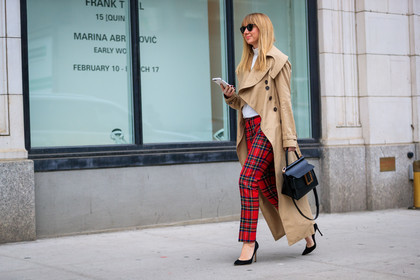 beige coat, black bag, black shoes, checked, checked pants, graphic pants, high heels, leather bag, leather shoes, plaid, printed pants, red pants, sunglasses, tartan, trench coat, trousers, white sweater, street style, jonathan paciullo, FW, frenchystyle, fashion week, NYFW, NEW YORK, AUTUMN WINTER 2018-2019, AW 18-19, FALL WINTER 2018-2019, FW 18-19, atmosphere details, horizontal, full length, lisa aiken