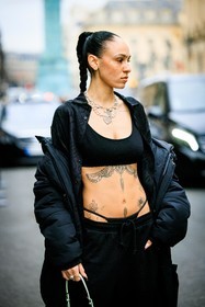black cropped top, tattoos, pony tails, black puffed jacket, black tong, black trousers, braided hair, hera pradel, fashion week, frenchystyle, FW, jonathan paciullo, street style, AUTUMN WINTER 2022-2023, FALL WINTER 2022_2023, FW 22-23, PFW, PARIS, vertical, detail
