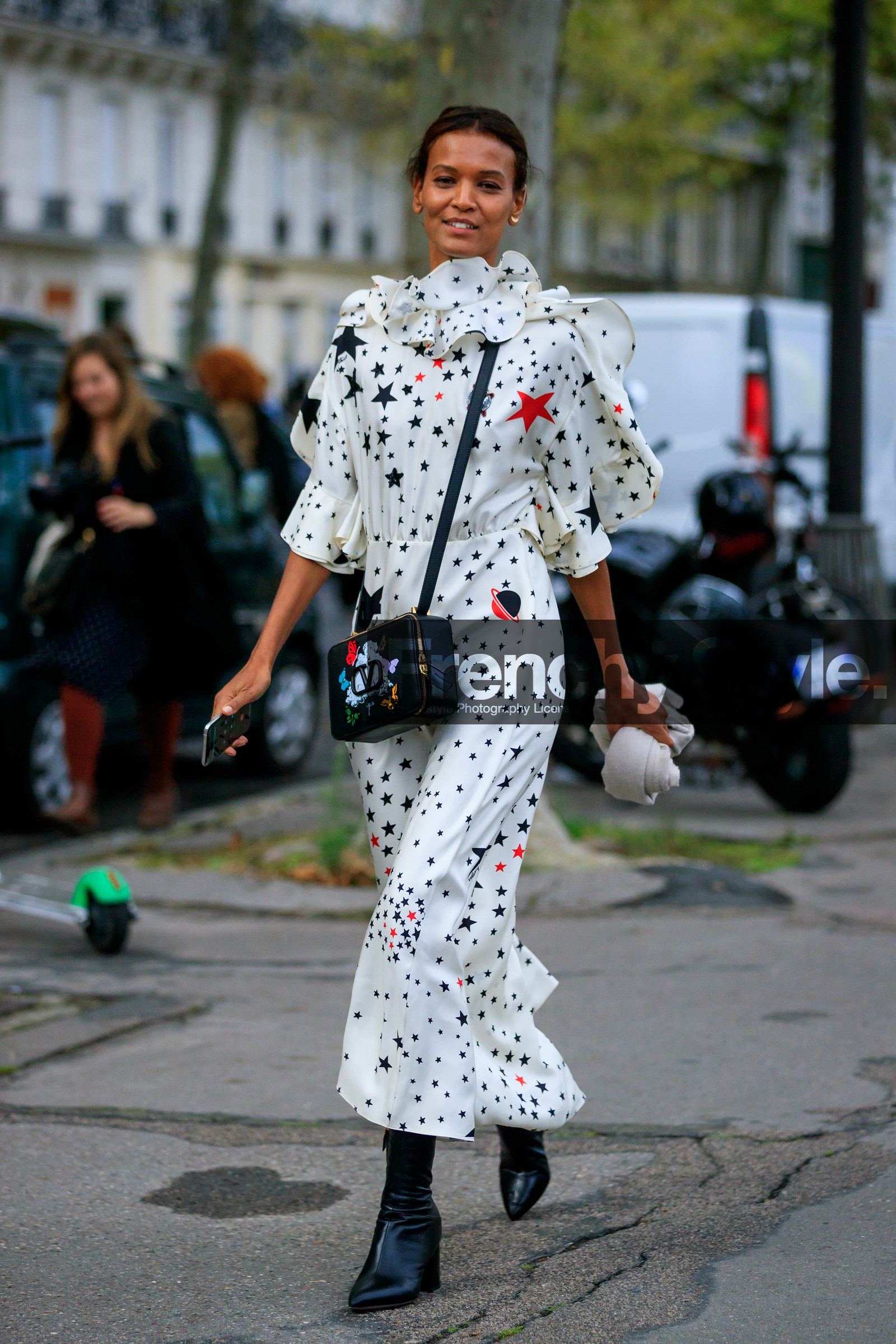 model, Liya Kebede, white dress, long dress, silk dress, printed dress, stars printed dress, high collar dress, mid long sleeves dress, big collar, ruffle dress, balloon sleeves, valentino bag, valentino dress, black leather bag, crossbody bag, animal printed bag, black leather boots, valentino look, PARIS, PFW, SPRING SUMMER 2020, SS 20, fashion week, frenchystyle, FW, jonathan paciullo, street style, vertical, full length