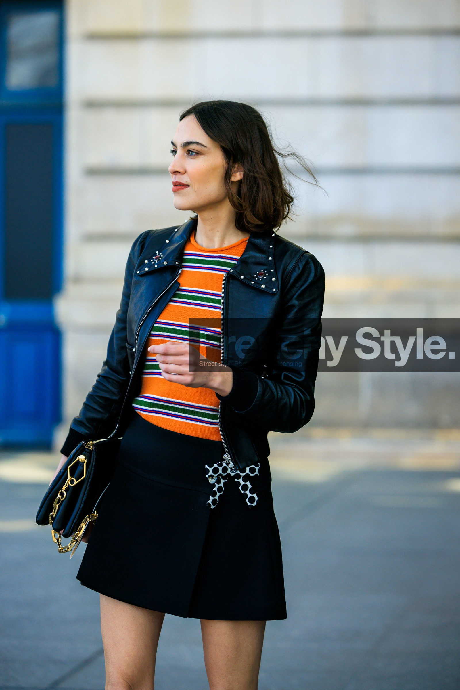black jacket, leather jacket, short hair, stripes top, orange top, multicolor top, mini skirt, bow skirt, black skirt, black handbag, louis vuitton, pillow bag, louis vuitton handbag, alexa chung, street style, jonathan paciullo, FW, frenchystyle, fashion week, AUTUMN WINTER 2022-2023, FALL WINTER 2022_2023, FW 22-23, PFW, PARIS, vertical, detail