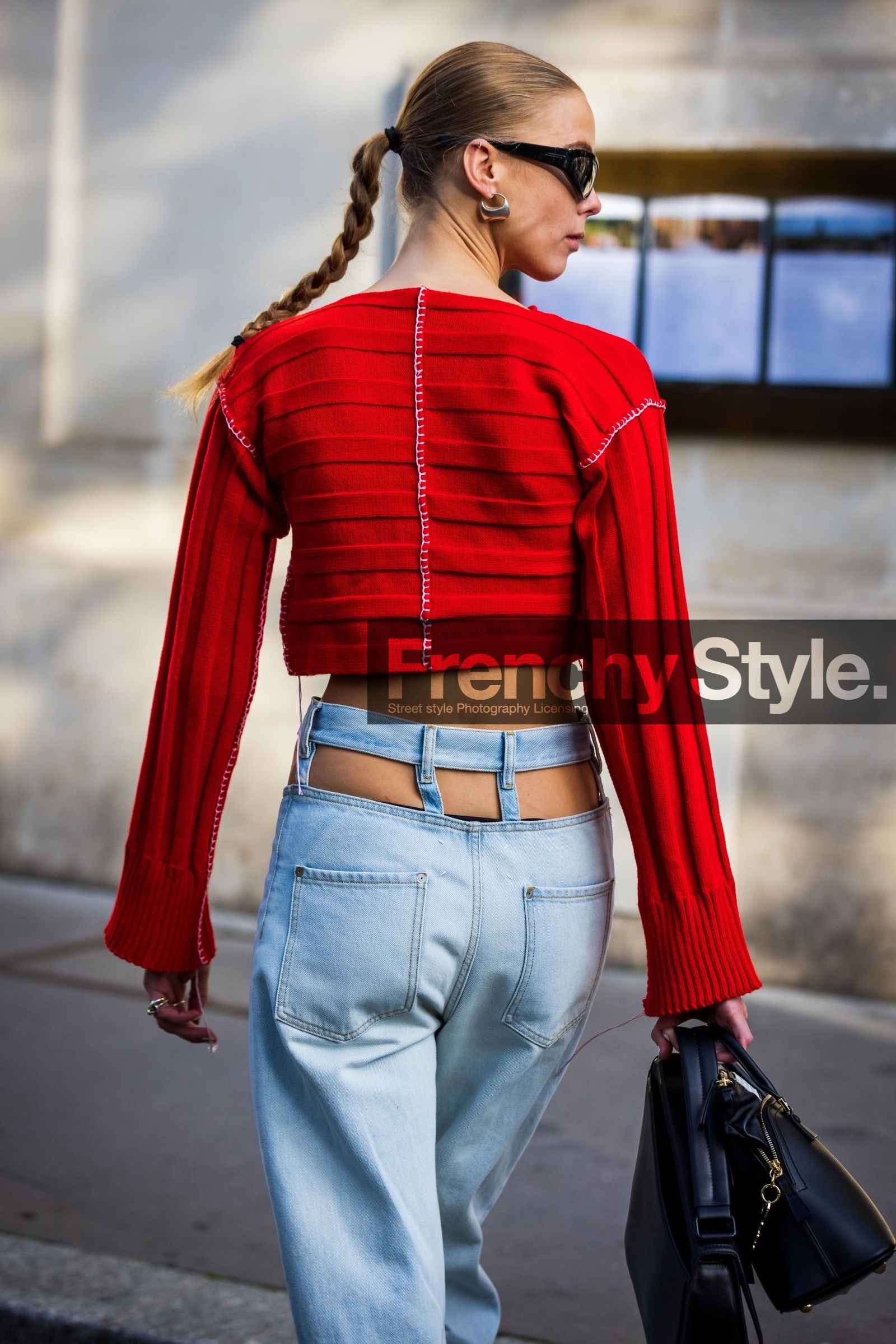 crop knitwear, bag, black bag, black sunglasses, cut out pants, denim, earrings, Hilda Sandstrom, jean, knitwear, light blue denim, light blue jean, red knitwear, sunglasses, back, back detail, street style, jonathan paciullo, FW, frenchystyle, fashion week, PFW, PARIS, SPRING SUMMER 2022, SS 22, vertical, atmosphere details