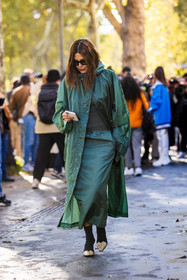boots, Christine Centenera, green raincoat, green skirt, long skirt, raincoat, smartphone, black boots, lacoste look, lacoste, fashion week, frenchystyle, FW, jonathan paciullo, street style, PFW, PARIS, SPRING SUMMER 2022, SS 22, vertical, full length