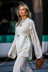 acne studios bag, acne studios look, bag, blue earrings, brown bag, corduroy pants, crop knit, crop top, long sleeves, monochrome, necklace, orange bag, pants, shirt, silver necklace, small bag, statement necklace, white crop top, white monochrome, white pants, white shirt, Xenia Adonts, street style, jonathan paciullo, FW, frenchystyle, fashion week, PFW, PARIS, SPRING SUMMER 2022, SS 22, vertical, atmosphere details