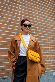 lena lademann, fendi bag, fendi baguette bag, yellow bag, yellow leather bag, monogrammed bag, crossbody bag, fendi coat, brown leather coat, openwork coat, black pants, silk pants, loose pants, black sunglasses, futurist shape sunglasses, butterfly sunglasses, street style, jonathan paciullo, FW, frenchystyle, fashion week, MFW, MILAN, SPRING SUMMER 2020, SS 20