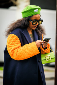 ganni beanie, green beanie, orange sleeves, black winter coat, kaki pants, baggy trousers, black belt, green handbag, black sunglasses, ganni cardigan, ganni cardigan, multicolor cardigan, green top, fashion week, frenchystyle, FW, jonathan paciullo, street style, AUTUMN WINTER 2022-2023, FALL WINTER 2022_2023, FW 22-23, PFW, PARIS, vertical, detail, dual toned jakcet