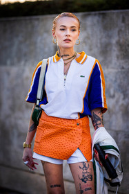 blue polo, gold watch, green bag, lacoste look, mini skirt, mocassins, Moesta Errabunda, orange skirt, polo, tattoo, watch, white polo, white shorts, zipped polo, lacoste, fashion week, frenchystyle, FW, jonathan paciullo, street style, PFW, PARIS, SPRING SUMMER 2022, SS 22, vertical, atmosphere details