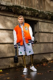 bag, beltbag, black bag, bomber, color, grey shorts, jogging, lacoste look, Lauren Wasser, orange bomber, shorts, sneakers, stripes, white sneakers, lacoste, fashion week, frenchystyle, FW, jonathan paciullo, street style, PFW, PARIS, SPRING SUMMER 2022, SS 22, vertical, full length