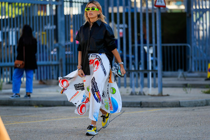 neon yellow sunglasses, gucci sunglasses, aurelie bidermann earrings, black earrings, polka dots earrings, hoop earrings, multi earrings, black leather shirt, oversize shirt, pleated skirt, letter printed skirt, marine serre skirt, white skirt, rolex watch, silvered watch, man style watch, lucky charm bracelet, multi bracelet, pearls bracelets, ankle bracelet, nike shoes, yellow sneakers, light grey sneakers, fashion week, frenchystyle, FW, jonathan paciullo, street style, atmosphere details, horizontal, full length