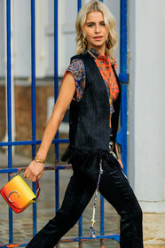 black jacket, black pants, bracelet, caro daur, chloé, earrings, graphic top, leather bag, orange bag, orange top, printed top, red bag, sleeveless, sunglasses, vest, white belt, yellow bag, PARIS, PFW, street style, jonathan paciullo, FW, frenchystyle, fashion week, AUTUMN WINTER 2019-2020, AW 19-20, FALL WINTER 2019-2020, FW 19-20, vertical, atmosphere details, detail
