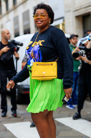 gabriella karefa johnson, neon green skirt, pleated skirt, mini skirt, long sleeves t-shirt, black sweatshirt, printed sweatshirt, prada bag, crossbody bag, yellow bag, chain strap bag, animal shape earrings, golden earrings, aviator sunglasses, yellow sunglasses, fashion week, frenchystyle, FW, jonathan paciullo, street style, MFW, MILAN, SPRING SUMMER 2020, SS 20