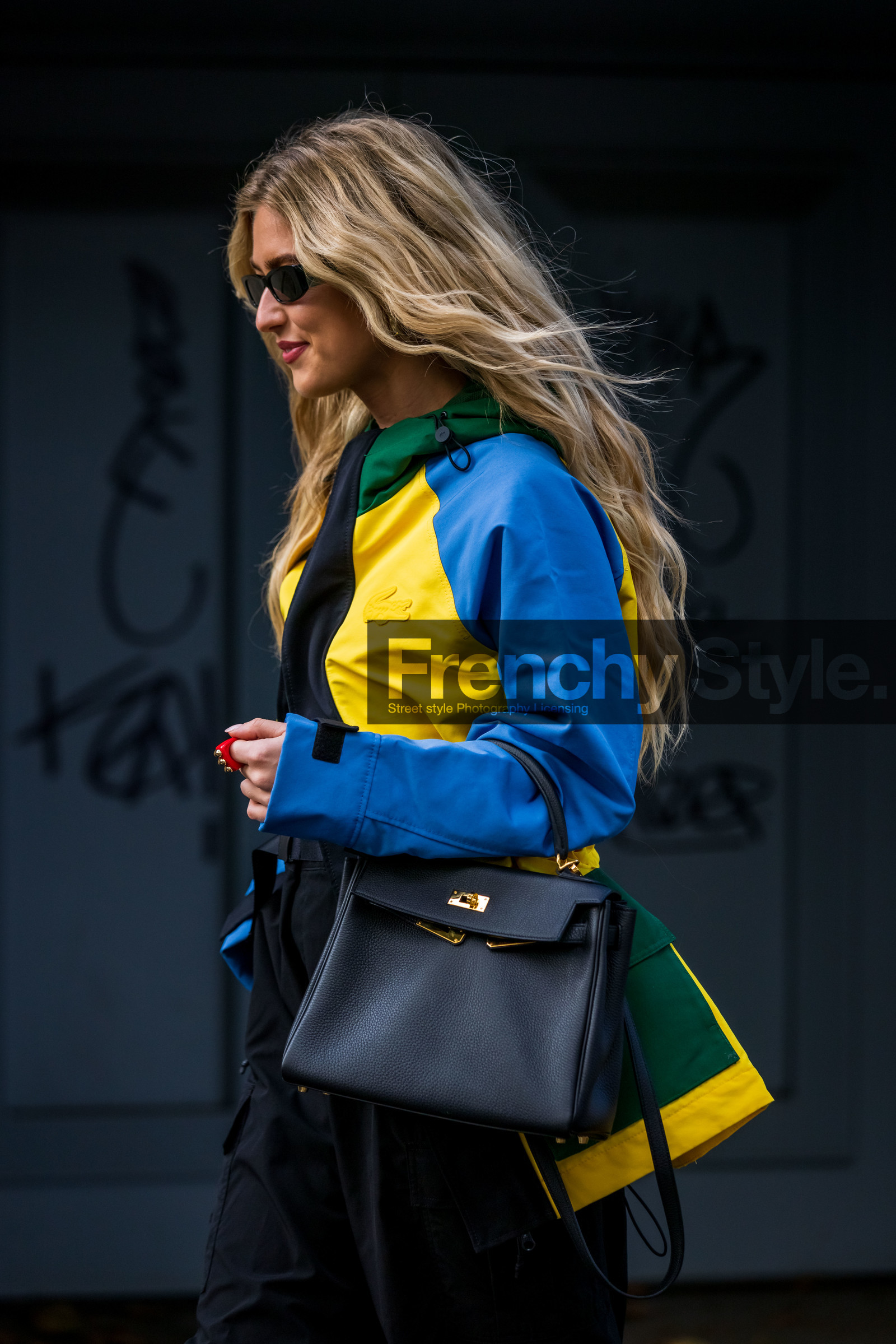 bag, black bag, black pants, black sunglasses, blue jacket, cap, color, Emili Sindlev, hermes bag, jacket, la manso ring, lacoste jacket, lacoste look, leather bag, pants, ring, sunglasses, yellow jacket, lacoste, fashion week, frenchystyle, FW, jonathan paciullo, street style, PFW, PARIS, SPRING SUMMER 2022, SS 22, vertical, atmosphere details