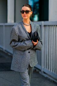 sophia roe, houndstooth printed jacket, grey jacket, grey pants, black jacket, black pants, black leather clutch, oversize jacket, silk top, satin top, black top, low necked top, beige sunglasses, square shape glasses, silvered necklace, big necklace, fashion week, frenchystyle, FW, jonathan paciullo, street style, MFW, MILAN, AUTUMN WINTER 2020-2021, FALL WINTER 2020-2021, FW 20-21, vertical, atmosphere details, detail