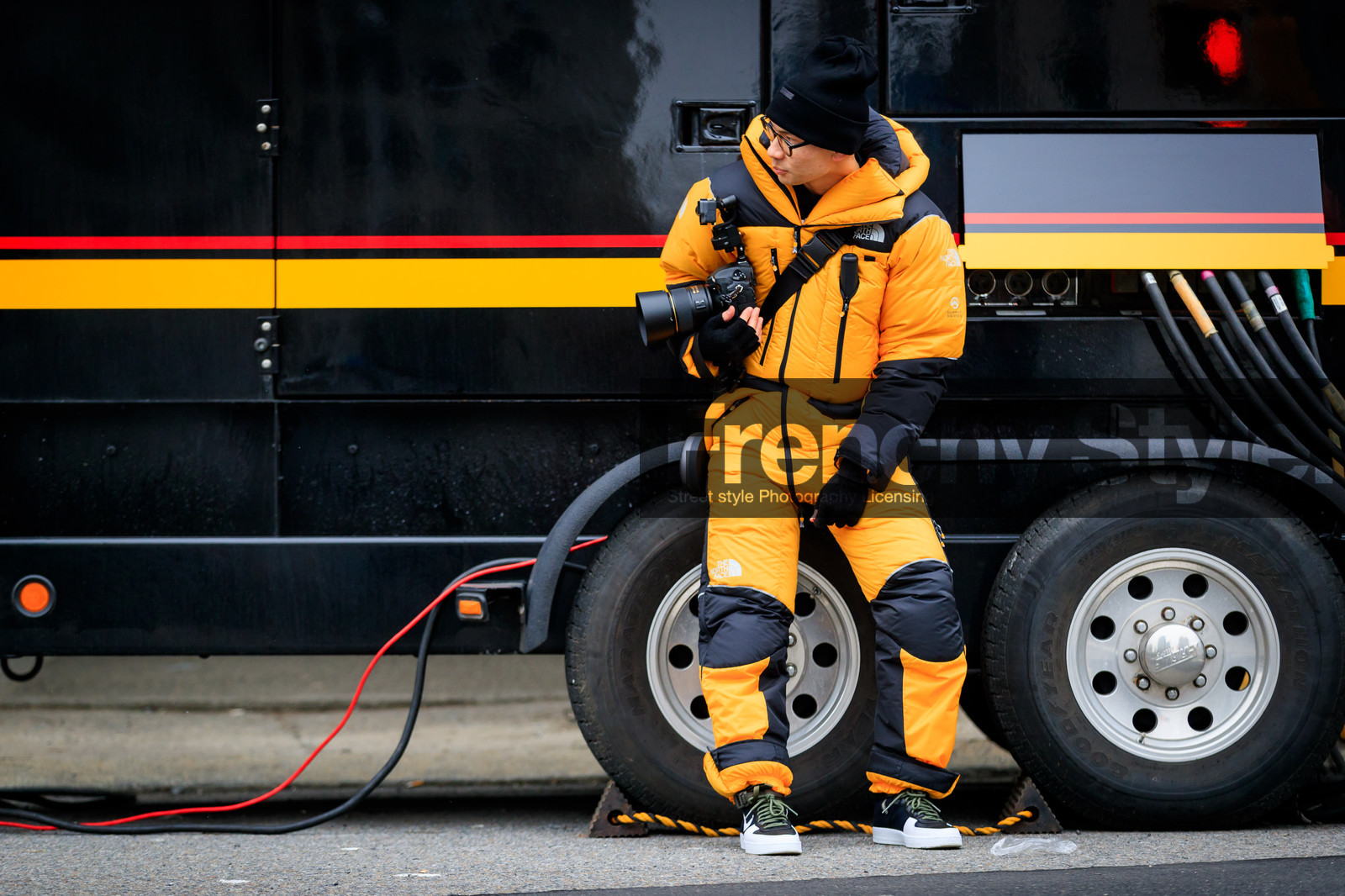 black beanie, black sneakers, camera, graphic jacket, leather shoes, printed jacket, trousers, yellow jumpsuit, street style, jonathan paciullo, FW, frenchystyle, fashion week, NYFW, NEW YORK, AUTUMN WINTER 2018-2019, AW 18-19, FALL WINTER 2018-2019, FW 18-19, atmosphere details, horizontal, full length, tyler joe
