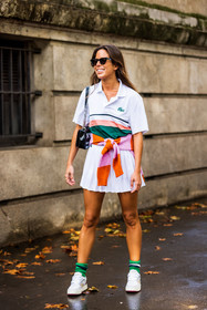 bag, black bag, black sunglasses, color, green socks, jumper, lacoste look, mini skirt, Nina Urgell Cloquell, orange jumper, pink jumper, pleated skirt, polo, skirt, sneakers, socks, stripes, sunglasses, tennis look, white polo, white skirt, white sneakers, lacoste, fashion week, frenchystyle, FW, jonathan paciullo, street style, PFW, PARIS, SPRING SUMMER 2022, SS 22, vertical, full length