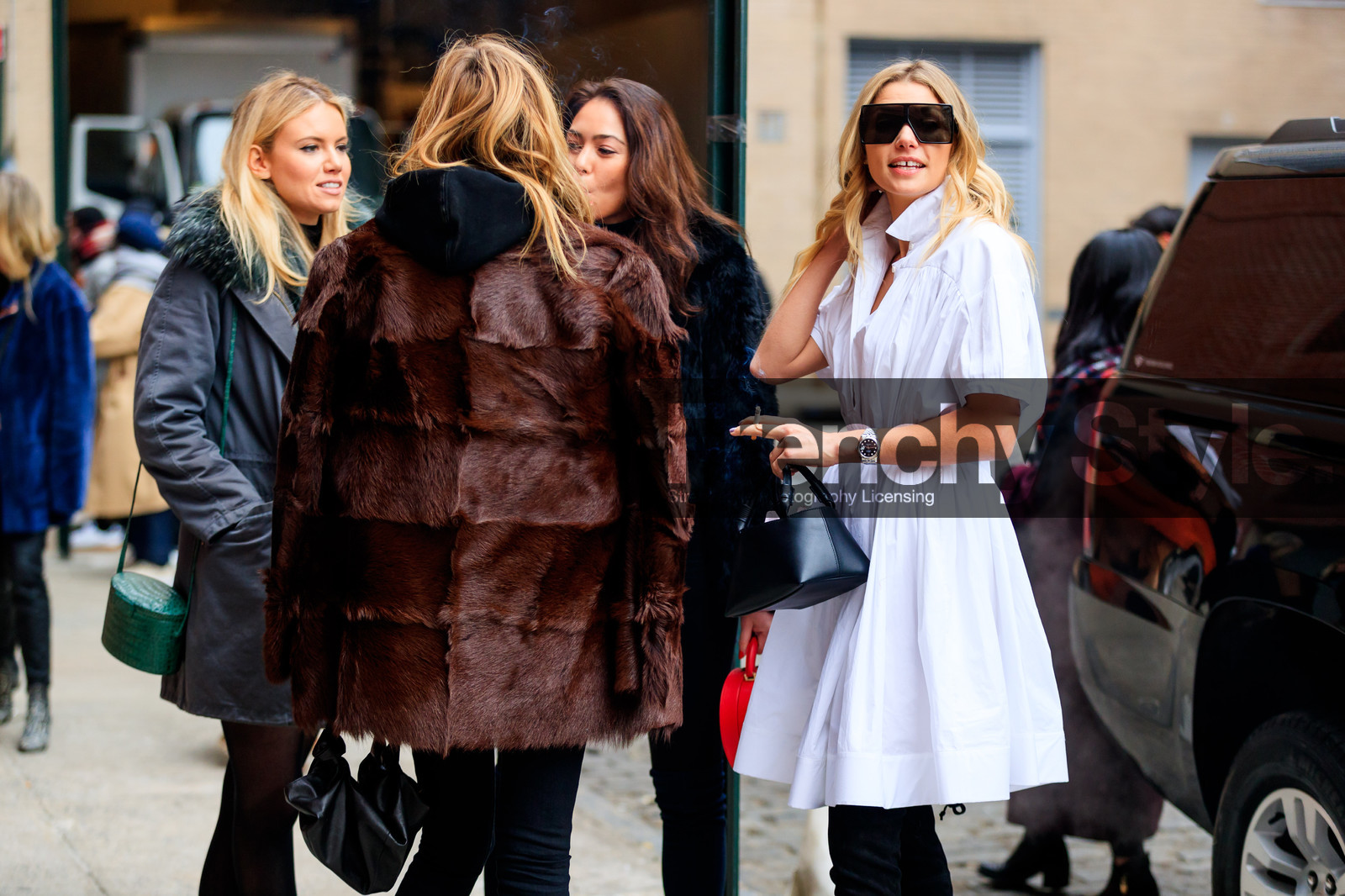 black bag, black boots, black pants, black sweater, brown fur, brown jacket, fur jacket, high boots, hoodie, leather bag, over the shoulder, sunglasses, trousers, white dress, street style, jonathan paciullo, FW, frenchystyle, fashion week, NYFW, NEW YORK, AUTUMN WINTER 2018-2019, AW 18-19, FALL WINTER 2018-2019, FW 18-19, atmosphere details, horizontal, detail, jessica hart