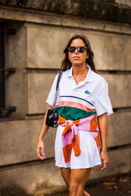 bag, black bag, black sunglasses, color, jumper, lacoste look, Nina Urgell Cloquell, orange jumper, pink jumper, pleated skirt, polo, skirt, stripes, sunglasses, tennis look, white polo, white skirt, lacoste, fashion week, frenchystyle, FW, jonathan paciullo, street style, PFW, PARIS, SPRING SUMMER 2022, SS 22, vertical, atmosphere details