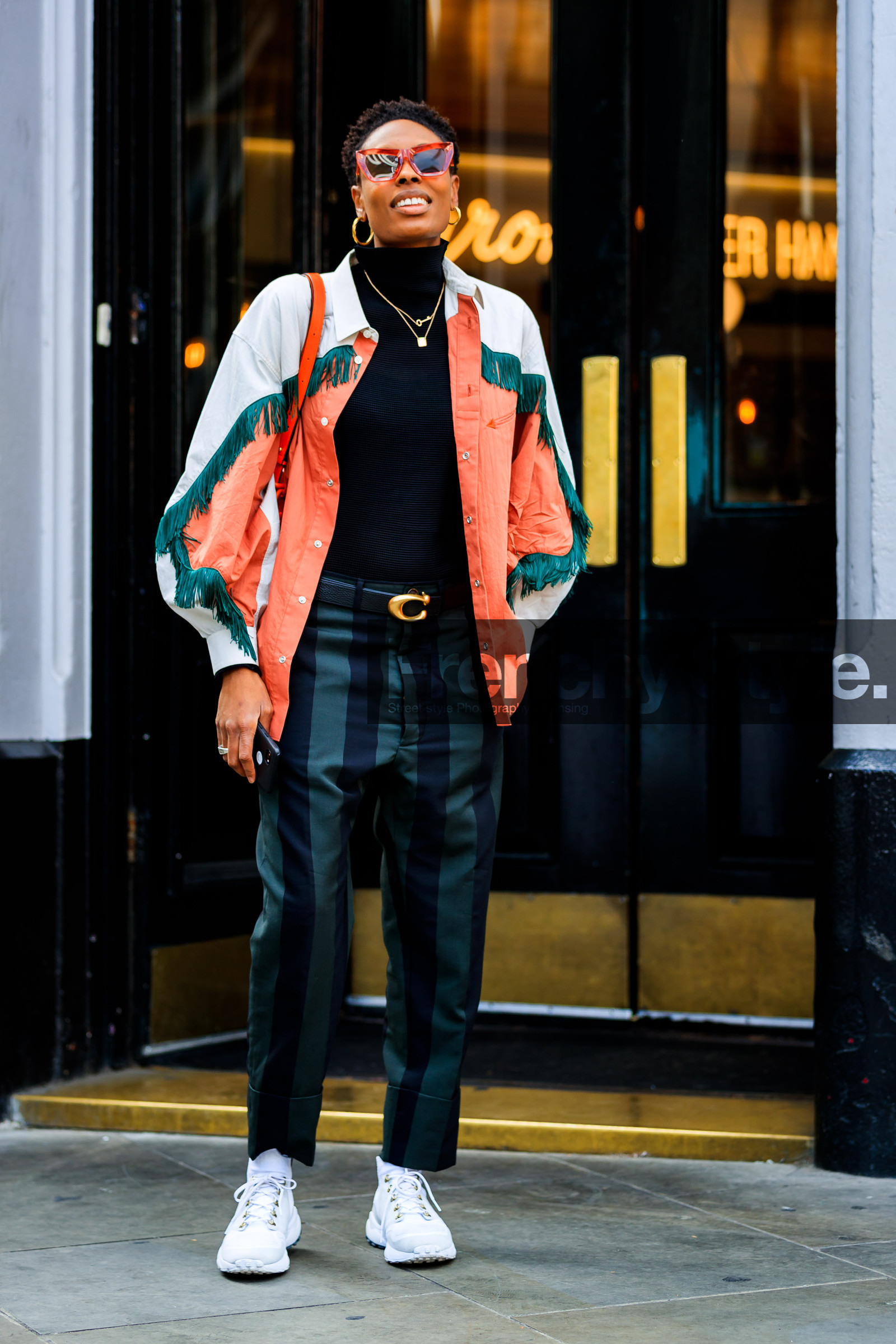 black belt, donna wallace, earrings, fringes, graphic jacket, graphic pants, green pants, leather bag, leather belt, leather shoes, orange jacket, printed jacket, printed pants, striped pants, sunglasses, trousers, white sneakers, fashion week, frenchystyle, FW, jonathan paciullo, street style, LFW, LONDON, SPRING SUMMER 2019, SS 19, vertical, full length