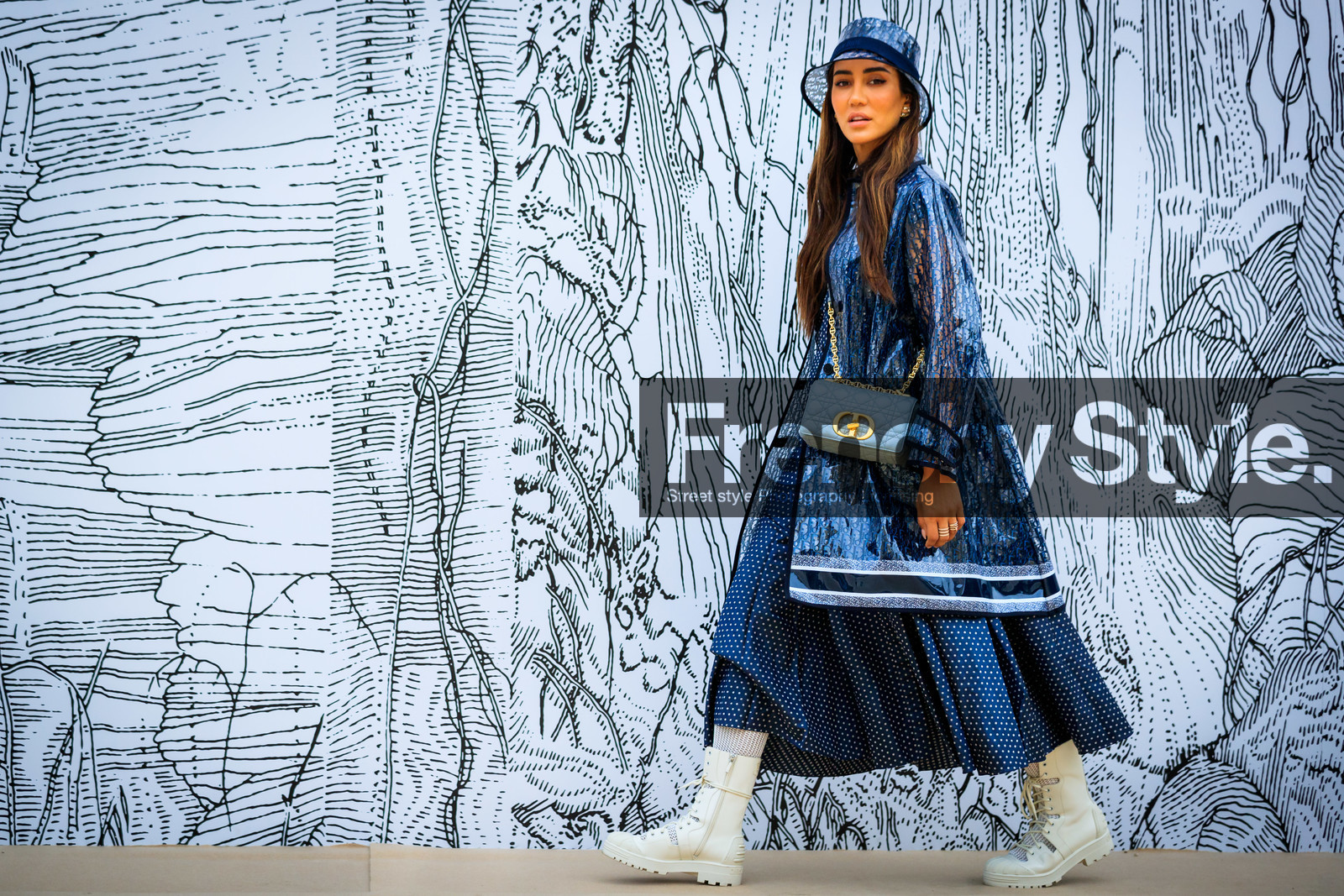 dior bag, dior hat, dior total look, dior trench coat, dior skirt, dior dress, logo all over, logo printed trench-coat, logo printed coat, logo printed hat, crossbody bag, light blue bag, light blue leather bag, quilted bag, blue bag, blue leather bag, chain strap bag, caro dior bag, sheer trench coat, polka dots dress, polka dots skirt, navy blue dress, navy blue skirt, navy blue trench coat, long dress, long skirt, white boots, lace boots, flat boots, big sole boots, monogrammed trench coat, monogrammed parka, monogrammed coat, tamara kalinic, fashion week, frenchystyle, FW, jonathan paciullo, street style, PFW, PARIS, AUTUMN WINTER 2021-2022, FALL WINTER 2021-2022, FW 21-22, atmosphere details, horizontal, detail