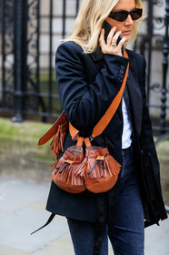lucy williams, black jacket, black sunglasses, ferragamo sunglasses, camel leather bag, multi bag, brown leather bag, round shape bag, crossbody bag, bag detail, close up detail, fashion week, frenchystyle, FW, jonathan paciullo, street style, LFW, LONDON, AUTUMN WINTER 2020-2021, FALL WINTER 2020-2021, FW 20-21, vertical, atmosphere details, detail