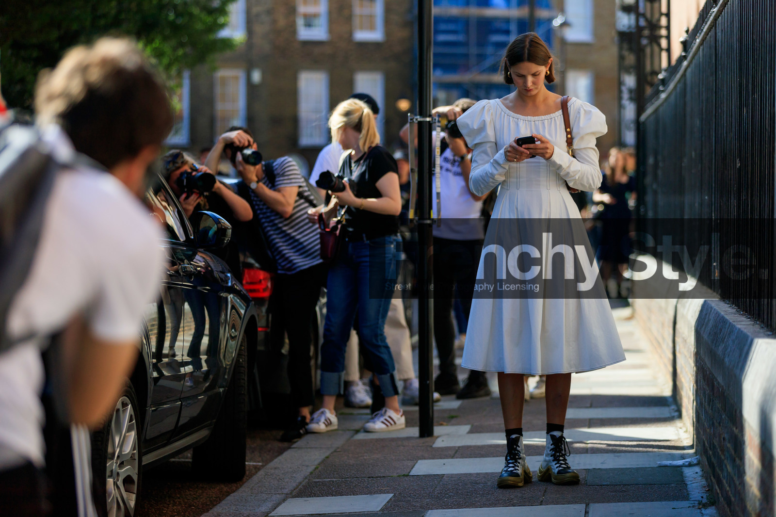 victoria sekrier, white dress, mid long dress, balloon sleeves, brown scale sunglasses, celine sunglasses, hoop earrings, golden earrings, long sleeves dress, brown leather bag, louis vuitton boots, louis vuitton sneakers, high sneakers, laced shoes, white leather shoes, white leather sneakers, golden sole, fashion week, frenchystyle, FW, jonathan paciullo, street style, atmosphere details, horizontal, detail