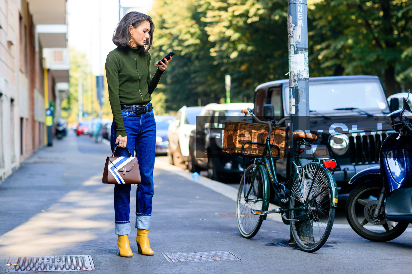 atmosphere details, blue denim, brown bag, brown belt, denim pants, diletta bonaiuti, fashion week, frenchystyle, full length, FW, graphic bag, green sweater, high heels, horizontal, jeans, jonathan paciullo, leather bag, leather belt, leather shoes, MFW, MILAN, printed bag, SPRING SUMMER 2017, SS 17, street style, striped bag, trousers, yellow boots