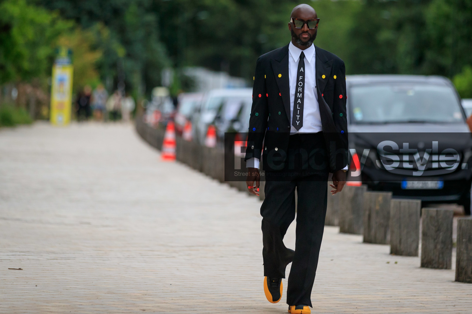 black jacket, black suits, black tie, black pants, white shirt, button details, button jacket, multicolor jacket, polka dots jacket, letter printed tie, scale sunglasses, louis vuitton sunglasses, black sneackers, yellow sneakers, virgil abloh, fashion week, frenchystyle, FW, jonathan paciullo, street style, PFW, PARIS, AUTUMN WINTER 2021-2022, FALL WINTER 2021-2022, FW 21-22, atmosphere details, horizontal, full length
