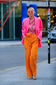 leonie hanne, color block look, neon pink jacket, oversize jacket, future shape sunglasses, neon pink shirt, pink sunglasses, miu miu shirt, sheer shirt, orange pants, oversize pants, jacquemus bag, mini bag, belt bag, orange leather bag, animal skin bag, strassed earrings, big earrings, bottega veneta shoes, squared toed shoes, chain detail shoes, fashion week, frenchystyle, FW, jonathan paciullo, street style, vertical, full length