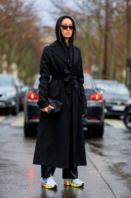 alexandra guerain, black hoodie, black trench coat, black pants, belted trench coat, off white trench coat, nike shoes, white sneakers, yellow sneakers, futurist shape sunglasses, scale sunglasses, purple sunglasses, fashion week, frenchystyle, FW, jonathan paciullo, street style, PFW, PARIS, vertical, full length