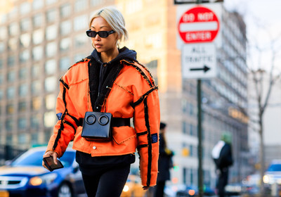 black bag, black belt, black denim, black sweater, denim pants, fanny pack, graphic jacket, hoodie, jeans, leather bag, leather belt, orange jacket, printed jacket, sunglasses, trousers, street style, jonathan paciullo, FW, frenchystyle, fashion week, NYFW, NEW YORK, AUTUMN WINTER 2018-2019, AW 18-19, FALL WINTER 2018-2019, FW 18-19, atmosphere details, horizontal, detail, vanessa hong