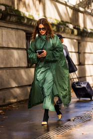 boots, Christine Centenera, green raincoat, green skirt, long skirt, raincoat, smartphone, black boots, lacoste look, lacoste, fashion week, frenchystyle, FW, jonathan paciullo, street style, PFW, PARIS, SPRING SUMMER 2022, SS 22, vertical, full length