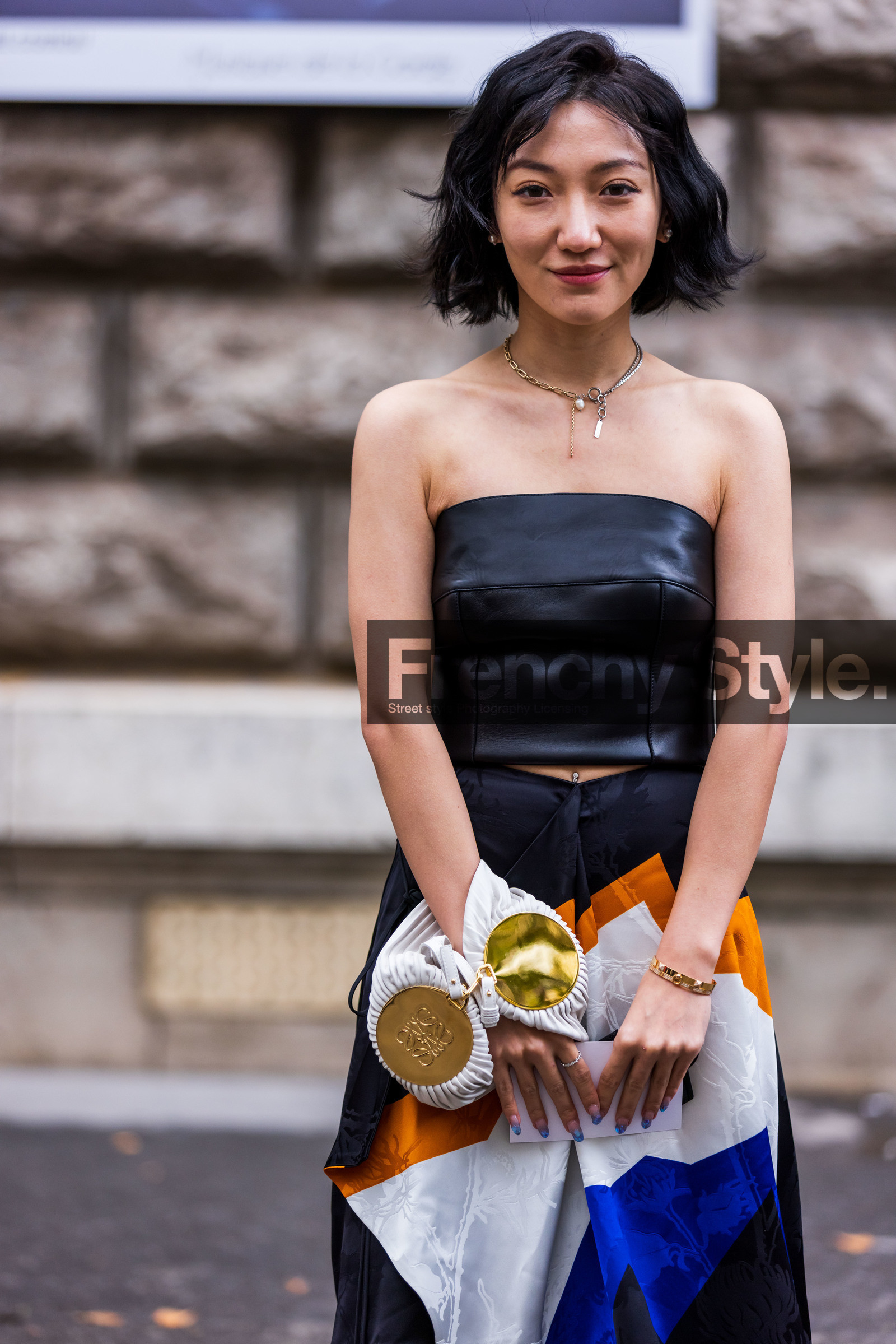 black bustier, black skirt, black top, bustier, gold, leather bustier, leather top, loewe bag, loewe look, patchwork, printed skirt, skirt, top, white bag, street style, jonathan paciullo, FW, frenchystyle, fashion week, PFW, PARIS, SPRING SUMMER 2022, SS 22, vertical, atmosphere details